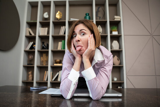 Funny Business Woman Sitting At The Desk In The Office