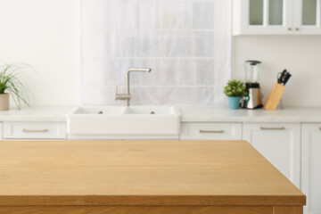 Fototapeta na wymiar Stylish wooden table in kitchen. Interior design
