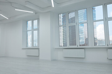 New empty room with clean windows and white wall