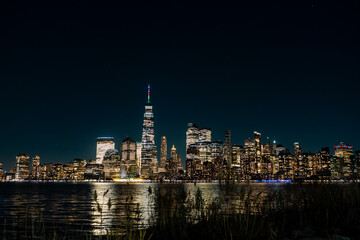 New York - Manhattan at night. Skyscrapers of a large metropolis. Night city at long exposure....