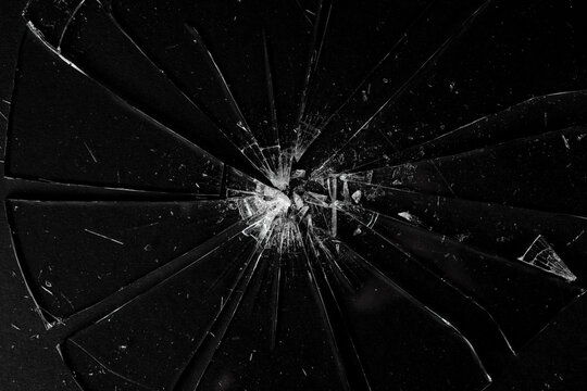 Broken glass on a black background.
