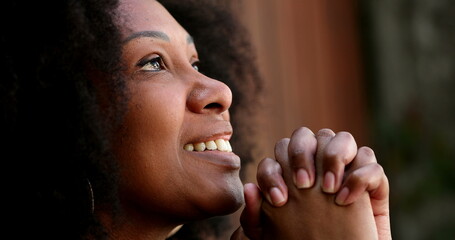 Happy smiling African woman feeling HOPE and FAITH