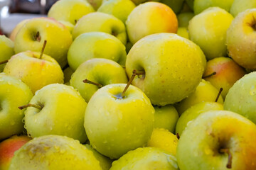 Variety of apples of different sorts in modern hypermarket