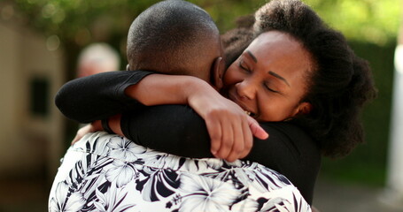 Happy couple hugging outside, two people embrace