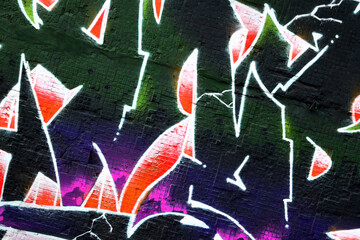 Colorful background of graffiti painting artwork with bright aerosol strips on metal wall. Old...