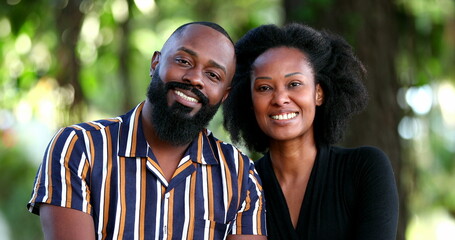 beautiful African couple posing outside in sunlight