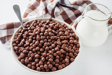 sweet crunchy chocolate children's breakfast chocolate balls on a white background