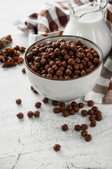 sweet crunchy chocolate children's breakfast chocolate balls on a white background