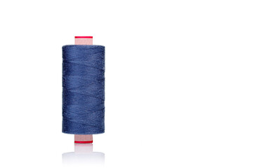 a skein of threads of blue color macro on a white background
