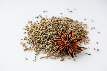 aromatic dry anise seeds on a white background