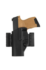 Short-barreled weapon in a plastic holster. Armament for the army and police. Modern semi-automatic pistol isolate on a white back.