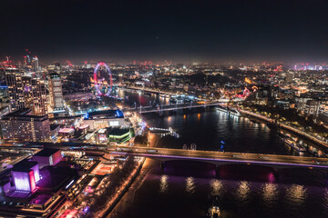 Fototapeta na wymiar Epic night aerial view of the London, River Thames, London Eye, Westminster. Panorama cityscape
