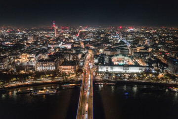 Epic night aerial view of the London, River Thames, London Eye, Westminster. Panorama cityscape