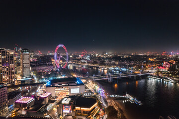 Epic night aerial view of the London, River Thames, London Eye, Westminster. Panorama cityscape