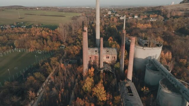 Abandoned old production plant, cement plant in Bedzin, Grodzisk, Poland. Concept of abandoned places, industrial ruins, urbex. View from the drone, air.