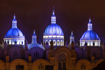 Three illuminated domes of the New Cathedral, Cuenca, Ecuador.