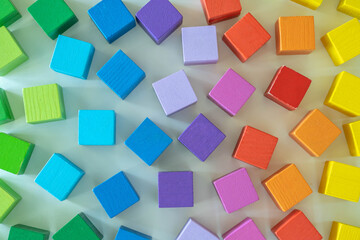 Fototapeta na wymiar Rainbow spectrum Montessori material wooden bricks row imagination seamless pattern background