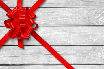 Decorative beautiful red ribbon bow on desk