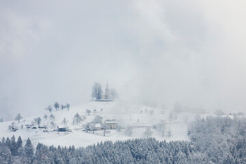 Sveti Tomaz Slovenia on foggy winter time
