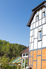 Half-timbered house with forest background in Germany