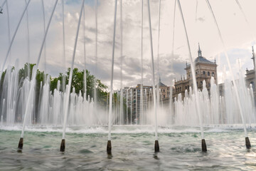 Fototapeta premium Water jets from a fountain near the academy of cavalry in Valladolid, Castilla y Leon, Spain.
