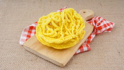 Kerupuk Mie or noodle crackers are the most popular food in Indonesia. Made from yellow noodles and garlic. Fried in hot oil, savory and crunchy.