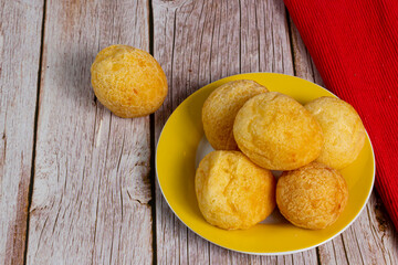 Cheese Bread, a traditional Brazilian breakfast, in portuguese called "Pão de queijo". Selective focus.