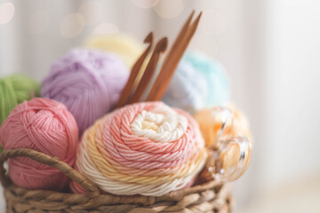 Cozy homely atmosphere. Female hobby knitting. Yarn pastel multicolor in a basket. 
