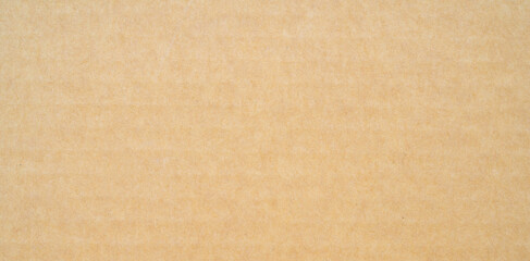 smooth brown cardboard paper, full frame, close up. background and texture of brown paper corrugated sheet board surface