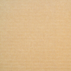 Fototapeta na wymiar smooth brown cardboard paper, full frame, close up. background and texture of brown paper corrugated sheet board surface