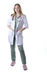 Full length portrait of the female physician in medical uniform with stethoscope isolated on white - 553610727