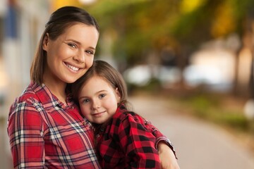 Fototapeta premium Happy young mother play with cute child in park