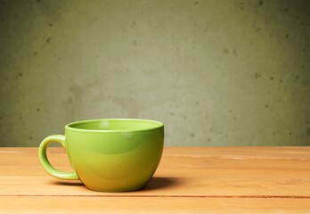 Green classic ceramic mug on table