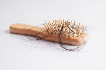 Hair loss fall with comb brush isolated on white background. - obrazy, fototapety, plakaty