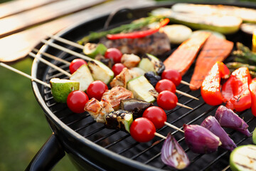 Delicious grilled vegetables on barbecue grill outdoors, closeup