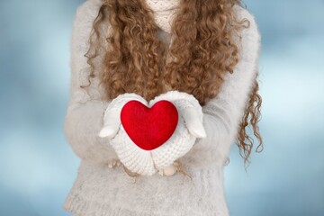 Woman hands hold a Read heart