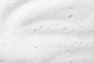 Fluffy soap foam as background, top view