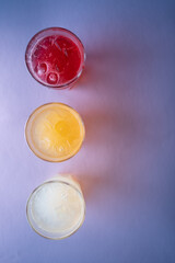 glasses set with fruit fresh colored juice of berry, lemon, ginger, strawberry