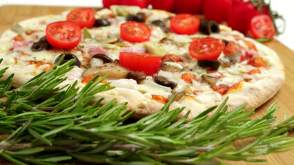 Fototapeta na wymiar Pizza with bacon, olives and tomato