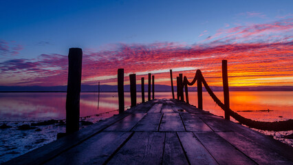 Fototapeta premium Sunrise of a wooden pier