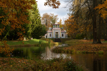 View of the Chinese gazebo on the bank of the Upper Ponds in the Catherine Park in Tsarskoye Selo on a sunny autumn day, Pushkin, St. Petersburg, Russia