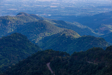 Obraz premium Overlapping mountains and blue sky