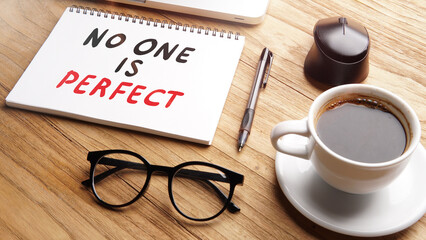 No one is perfect, text words typography written on paper against wooden background, life and...