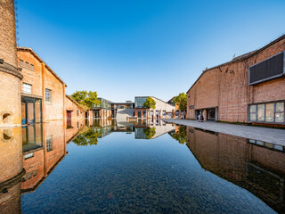 Red old factory building by the water, red brick house，Jingdezhen, Jiangxi, China,