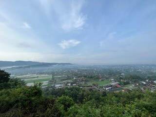 Beautiful aerial view from the top of Gunung Wamgi which is one of tourism destination in Yogyakarta, Indonesia. Photo shows established communities and nature.