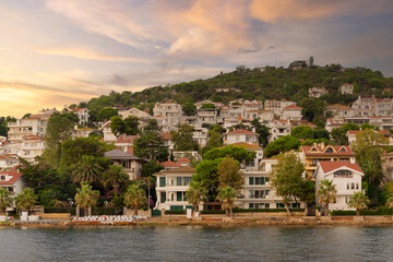 Fototapeta premium View of the mountains of Kinaliada island from Marmara Sea, with traditional summer houses and boats, Istanbul, Turkey