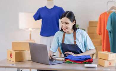 Portrait young attractive hipster asia female owner startup work happy with box at home prepare parcel delivery in sme supply chain, procurement, Asian omnichannel Sme ecommerce online concept.