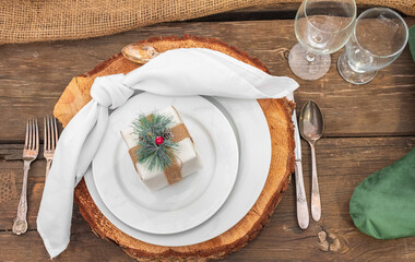 Rustic christmas served table. Beautiful table setting with Christmas decorations in living room