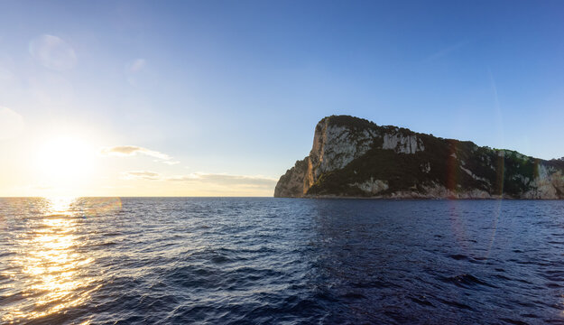 Capri Island in Bay of Naples, Italy. Sunny Sunrise Sky. Nature Background.