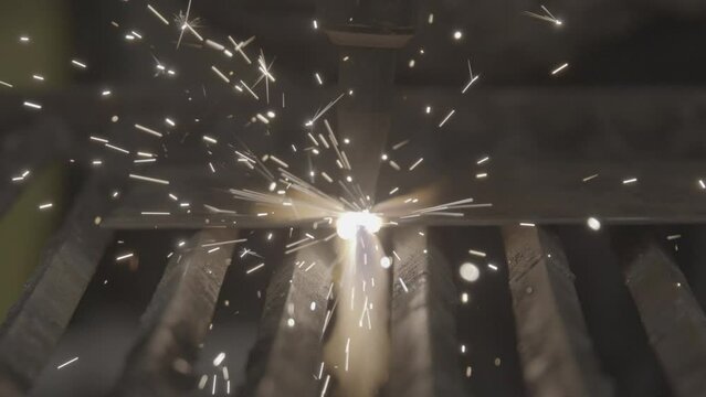 Shop class cutting metal with torch slow motion close up